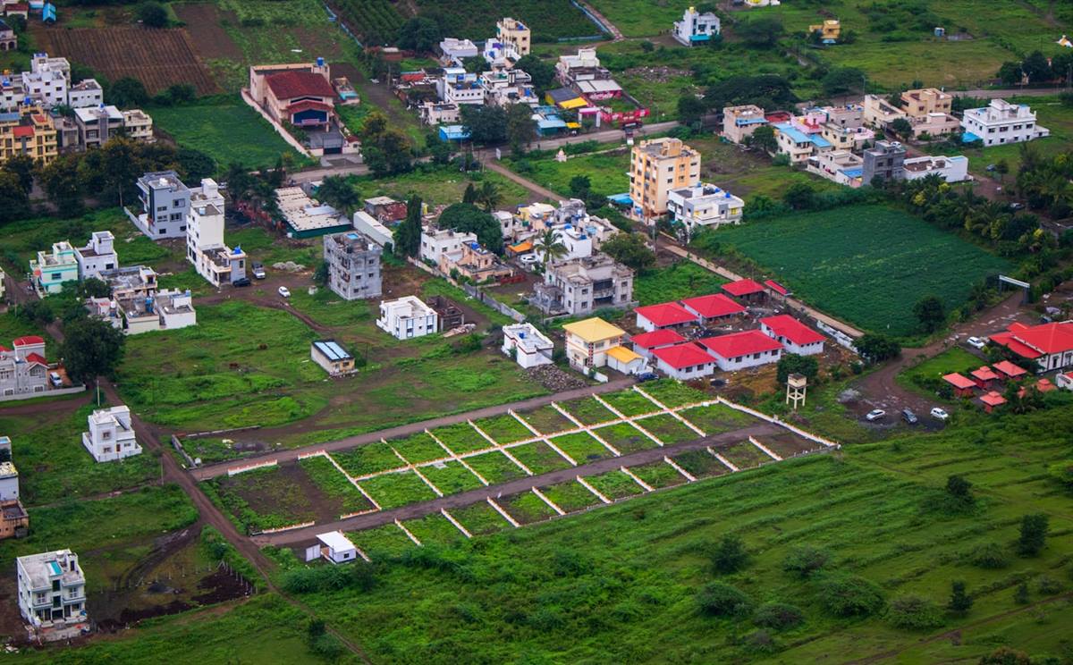 Aerial view of a surveyed land subdivision with plot markers
